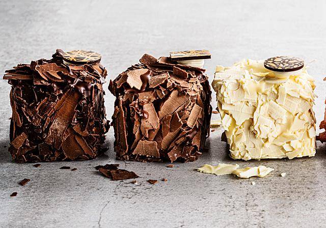 Merveilleux pastries with white, milk and dark chocolate shavings