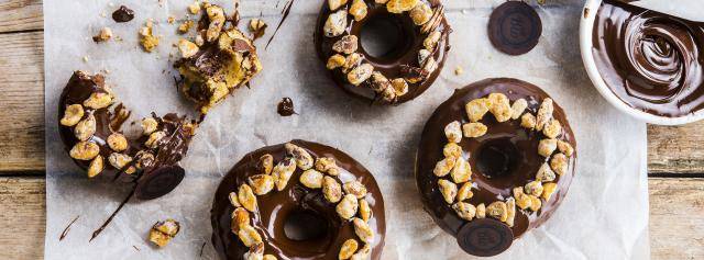 Vegan donuts with organic dark chocolate coating and bio nuts