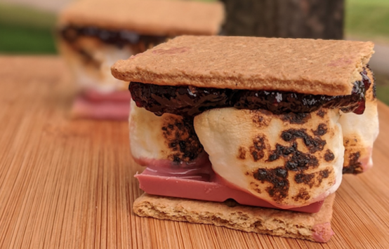 s'more with ruby chocolate on outdoor table