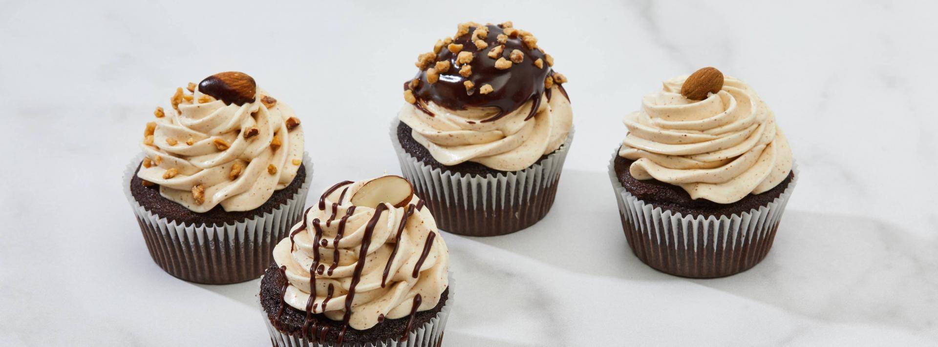 chocolate almond cupcakes on a table cloth