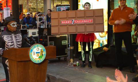 Chicago Mayor Lori Lightfoot speaks to the crowd at the Arts in the Dark Parade, sponsored by Barry Callebaut