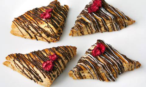 Four scones drizzled with dark and white chocolate 