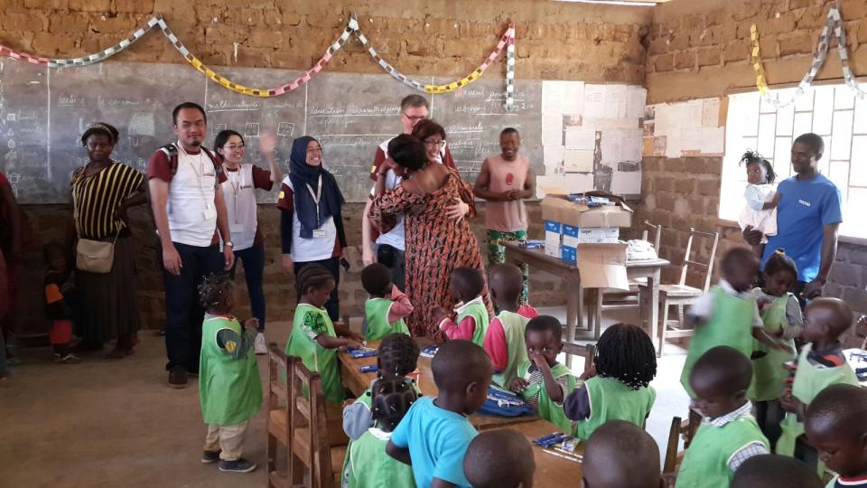 Barry Callebaut Water for Life champions during Cameroon cocoa study tour - distributing school supplies at primary school
