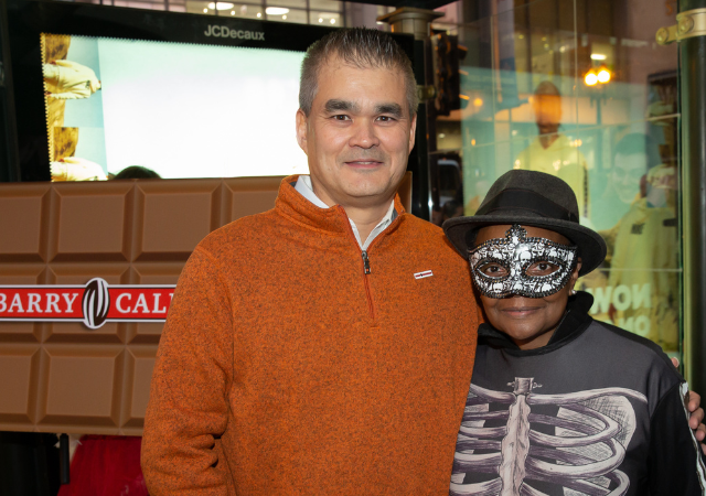 Americas' President Steve Woolley stands next to costumed Mayor Lori E. Lightfoot