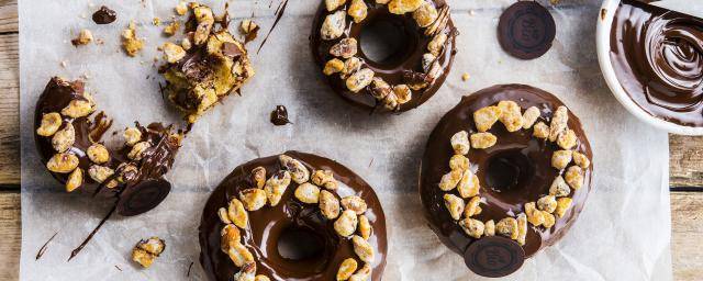 Vegan donuts with organic dark chocolate coating and bio nuts